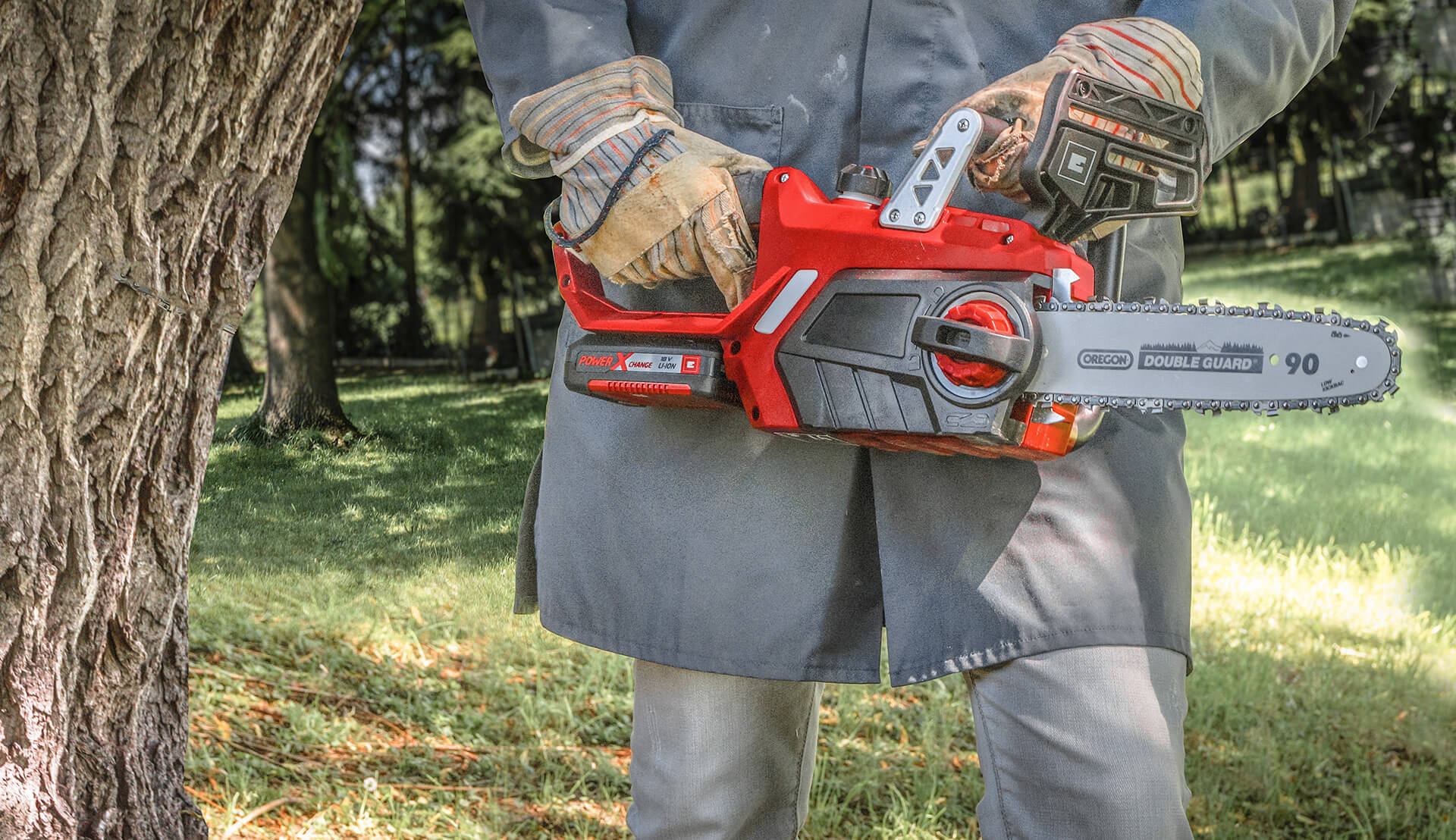 man holding a chainsaw in his hand